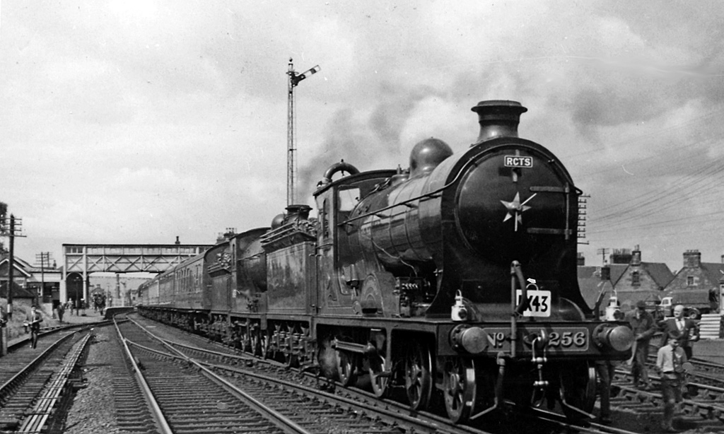 Steam train at St Boswells, treated as a faded historical illustration